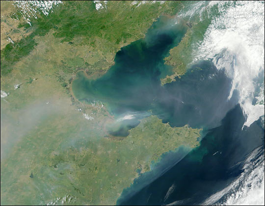NASA’s Terra satellite image of a thick plume of aerosol pollution over eastern China, extending eastward over the Bo Hai Bay and Korea Bay. Courtesy of NASA