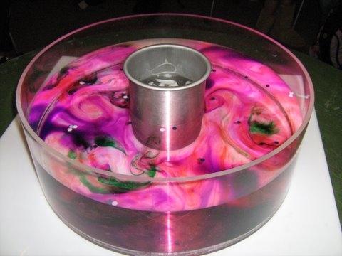 Colorful dye reveals fluid behavior in a rotating tank - image: J. Holt