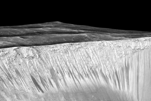 Mars’ Valles Marineris canyon, pictured, spans as much as 600 kilometers across and delves as much as 8 kilometers deep. The image was created from over 100 images of Mars taken by Viking Orbiters in the 1970s. (Image: NASA)